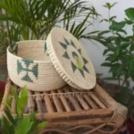 a hand woven sabai basket with lid