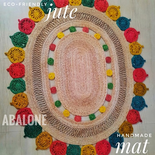 a hand woven oval shaped jute mat