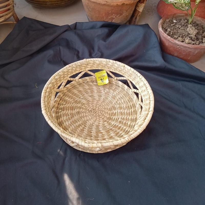 a designer round basket for gift hamper