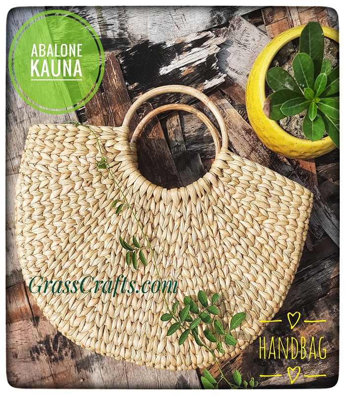 a hand woven kauna bag or handbag with cane handle