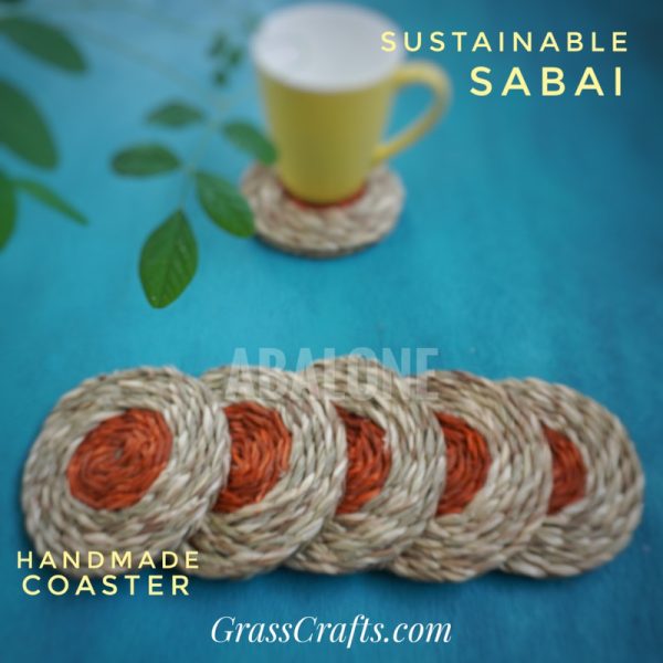 set of eco-friendly sabai coasters with a yellow cup on a table