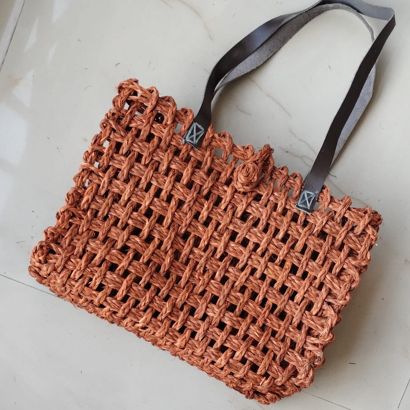 a tote bag with leather handle