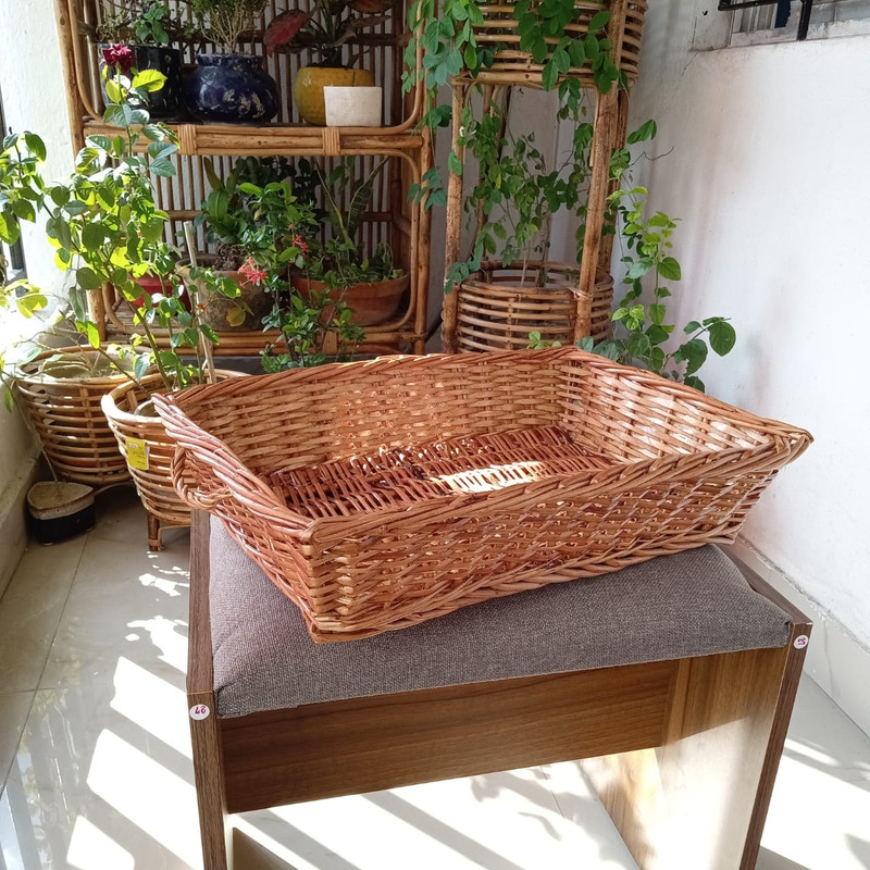 A rectangular wicker Basket with handle for gift hampers, vegetables and fruits