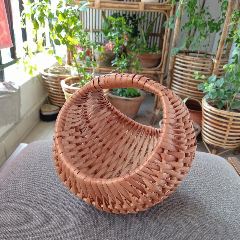 a round wicker basket for gift hamper and flower decoration